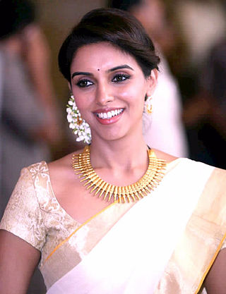 A photograph of Asin at a wedding