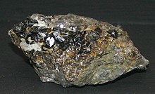 Sample of cassiterite, the main ore of tin Cassiterite09.jpg