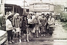 A group of Argentine travestis carrying the coffin of their murdered friend, August 1987. Cortejo funebre travesti.jpg