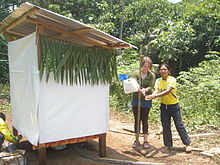 A tippy tap for handwashing after using a urine-diverting dry toilet in Pumpuentsa, Ecuador Finished UDDT in Pumpuentsa (5630907486).jpg