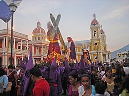 Lent observers, including a confraternity of penitents, carrying out a street procession during Holy Week, in Granada, Nicaragua. The violet color is often associated with penance and detachment. Similar Christian penitential practice is seen in other Christian countries, sometimes associated with fasting. Holy Week procession in Granada, Nicaragua.jpg