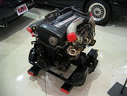 The RB26DETT found in R32 and R33 GT-Rs. Notice how the valve cover is not metallic red or champagne metallic, the R34 series came with painted valve covers.