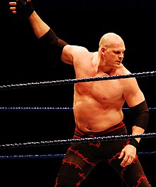 Kane preparing for a chokeslam at a WWE Live Event in February 2008. Kane in February 2008 (cropped).jpg
