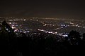 GC Melbourne viewed from Skyhigh on Mount Dandenong. The red and blue lights in the far background are lights atop the two tallest buildings in Melbourne, the Eureka Tower (red) and the Rialto Towers (blue).