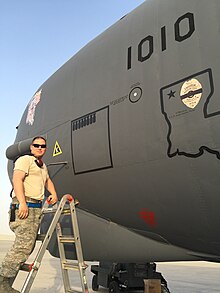 B-52 Crew Chief SSgt Figueroa stenciling completed bombing sorties on B-52H (61-0010) during Operation Inherent Resolve, in part of the Military intervention against ISIL at Al Udeid Air Base, in Qatar. Operation Inherent Resolve.jpg