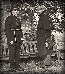 Victorian Police Officer with itinerant circa 1900 - recreation. The officer is pictured wearing a duty armband on his left wrist. Police-Victorian-1256.jpg
