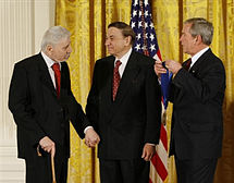 The Sherman Brothers receive the National Medal of Arts at The White House on November 17, 2008, (left to right: Robert B. Sherman, Richard M. Sherman and U.S. President George W. Bush) RBS RMS GWB medal 2008.jpg