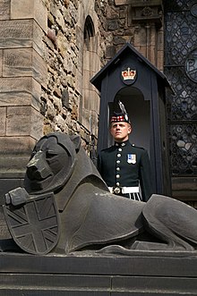 Sentry in a sentry box and the heraldic lion from the royal arms with its Union Jack shield by Phyllis Bone Soldier, Edinburgh Castle - geograph.org.uk - 670531.jpg