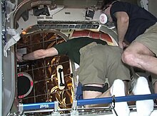 Don Pettit opening Dragon's hatch on 26 May. TVCOTS2 opening hatch.jpg