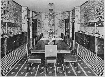Photograph of the Stoclet Palace's dining room, with furniture by Hoffmann and ceramic frieze by Gustav Klimt