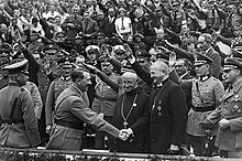 Hitler shaking hands with Lutheran Bishop Ludwig Muller in Germany in the 1930s Hitler with Catholic dignitaries.jpg
