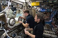 The International Space Station of today is a modern research facility ISS-50 Peggy Whitson and Thomas Pesquet with the Microgravity Science Glovebox in the Destiny lab.jpg