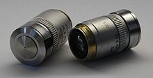 Two Leica oil immersion microscope objective lenses; left 100x, right 40x. Leica EpifluorescenceMicroscope ObjectiveLens.jpg