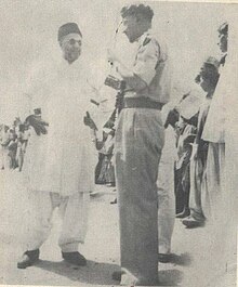 Third Caliph of the Ahmadiyya Muslim Jama'at Mirza Nasir Ahmad conversing with Furqan Force colonel Sahibzada Mubarak Ahmad Mirza Nasir Chating with Furqan Force Colonel Sahibzada Mubarak Ahmad.jpg