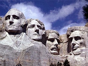 The faces of (left to right) George Washington...
