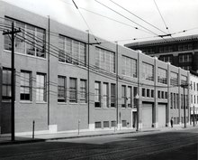 Photograph of a two-story brick warehouse