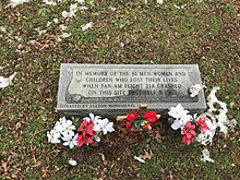 Short rectangular granite monument that reads, "In memory of the 81 men, women and children who lost their lives when Pan Am Flight 214 crashed on this site December 8, 1963. Donated by Elkton Monuments"