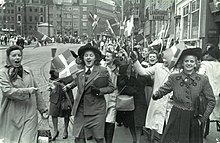 People celebrating the liberation of Denmark at Stroget in Copenhagen, 5 May 1945. Germany surrendered two days later. People celebrating the liberation of Denmark. 5th May 1945. At Stroget in Copenhagen..jpg