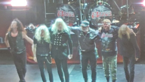 Saxon performing at Leeds First Direct Arena in 2024