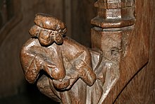 A 16th-century carving in a Belgian church, showing a woman expressing her milk into a bowl. Walcourt - Parclose - Satire d'une nourice.JPG