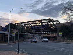 Argyle Street railway bridge, Moss Vale. Photo taken on the corner of Arthur and Argyle Street. There is a train passing over the bridge at the moment this photo was taken.