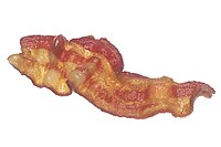 Cooked rasher of streaky bacon