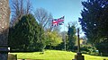 Churchyard with flag and war memorial