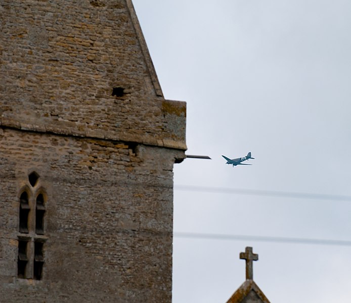 File:Normandy 10 Angoville-au-Plain Liberty Jump Team passing church (4824159497).jpg