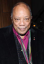 Quincy Jones's Oscar is a non-competitive award while his final qualifying award was a competitive Tony for The Color Purple in 2016. Quincy Jones May 2014.jpg