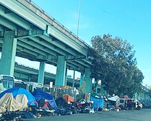 Homeless encampment under a freeway in San Francisco San Francisco Homeless Tents (cropped).jpg