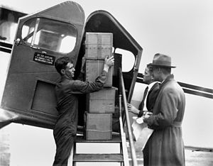 Unloading air freight from a plane, Queensland...