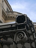 The Royal Cypher of King Carol II of Romania on the porch roof of the Royal Palace of Bucharest.jpg