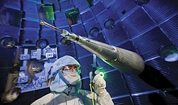 Engineers, scientists and technicians at work on target positioner inside National Ignition Facility (NIF) target chamber Worker inside the target chamber of the National Ignition Facility.jpg