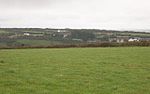 Across the valley to Barkla Shop from a spot near Ropewalk Farm looks east across the valley. The village of Mithian lies over the far hillside.