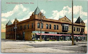 Hand-tinted postcard of the Hotel Reichert circa 1910, showing the former pyramidal corner towers