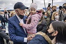 American President Joe Biden holding a Ukrainian refugee at Warsaw's Stadion Narodowy in a meeting where he described Russian President Vladimir Putin as "butcher", 26 March 2022 P20220326AS-2014 j2 (52036398865).jpg