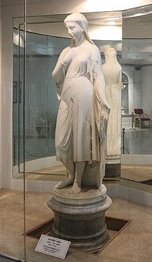 Full height, white marble statue of Veiled Rebecca at Salar Jung Museum