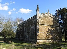 A chapel in one cell with a battlemented parapet and crocketted pinnacles at the corners