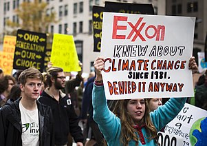 A protestor demonstrating as part of the "Exxon knew" movement in Washington, DC in 2015 "Exxon Knew" sign on a BLM protest in Washington, DC (2015).jpg