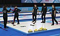 Team Japan discusses the last stone in the last end