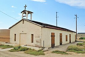 The original church; the two stained glass windows in the front were removed for safe-keeping.