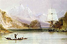 On a sea inlet surrounded by steep hills, with high snow covered mountains in the distance, someone standing in an open canoe waves at a square-rigged sailing ship, seen from the front