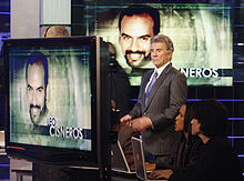 John Walsh presents a fugitive on America's Most Wanted John Walsh filming a segment for America's Most Wanted.jpg