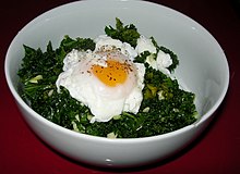 An example of a low-carbohydrate dish, cooked kale and poached eggs Kale & Poached Eggs Salad (8733071700).jpg