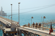 US Navy and Coast Guard personnel stand guard aboard the Al Basrah Oil Terminal in July 2009. MESFABOT.png