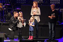 West with his family (L-R) Lulu, Delaney, Emily, and his mother in 2013 Matthew West Family and Mother.jpg