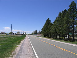 Looking west down Highway 94, Pikes Peak is in the distance