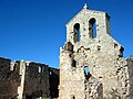 Vista frontal (occidental) de la iglesia de la Trinidad en Moya (Cuenca), con detalle de la espadaña, antes de su restauración.