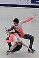 Chinese ice dancers Huang Xintong and Zheng Xun perform a curve lift at the 2009 Cup of China