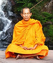 Buddhist monk during meditation near Phu Soidao National Park Abbot of Watkungtaphao in Phu Soidao Waterfall.jpg